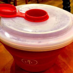 Red silicone popcorn popper bowl with butter compartment